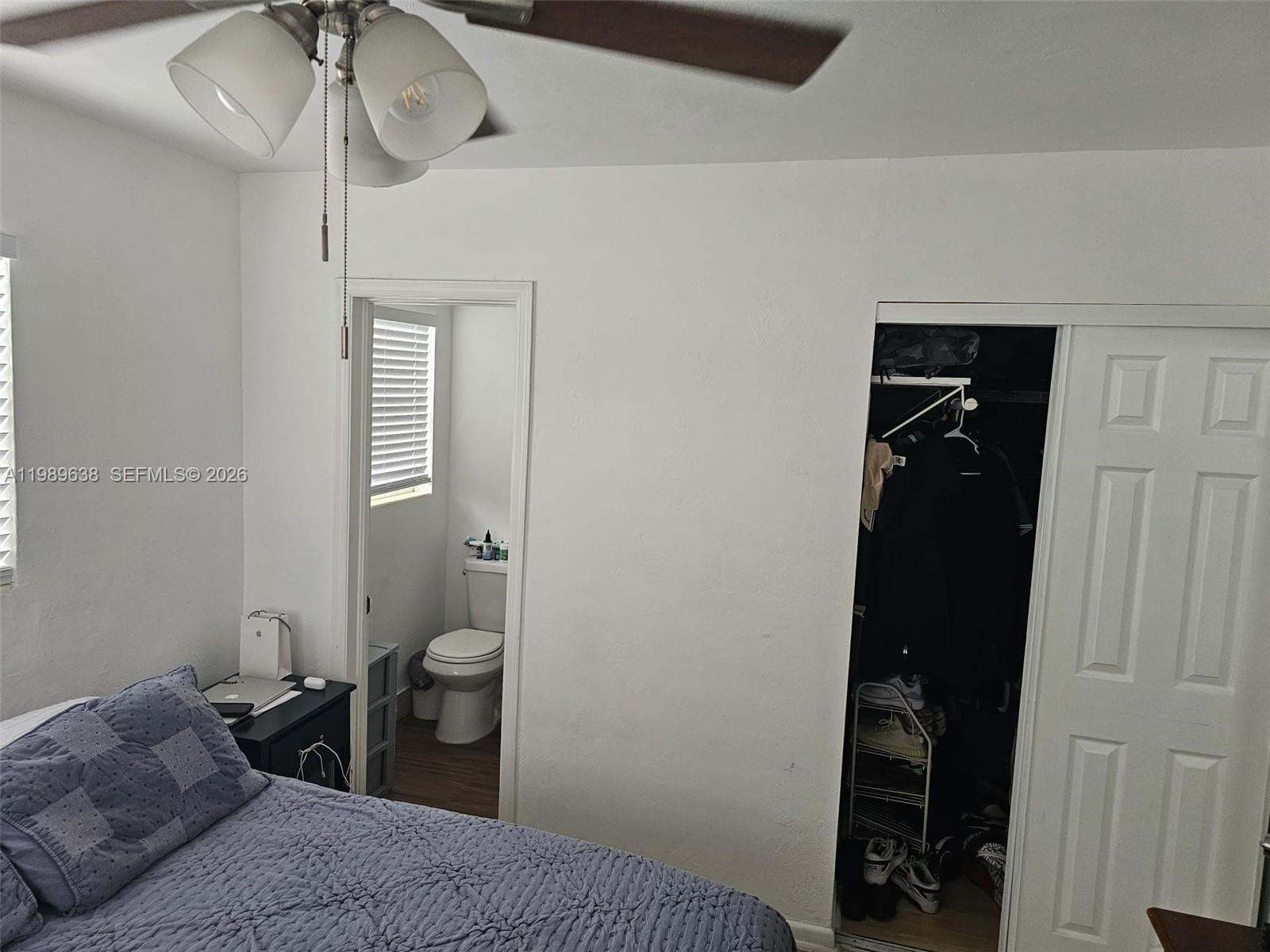 569 Tallulah Road Lake Worth, FL 33462 - Photo 19 of 40 a bedroom with a bed and a walk in closet