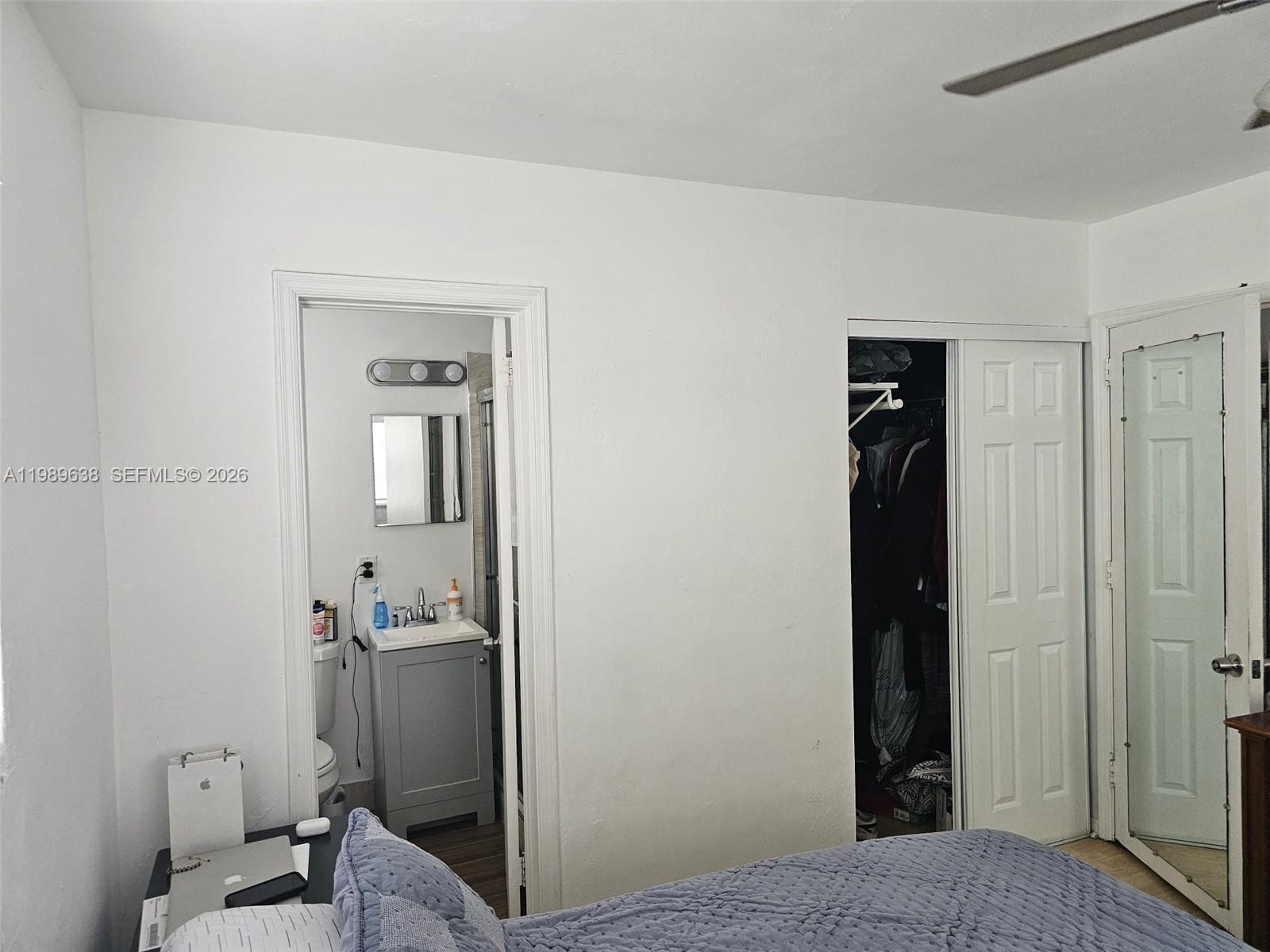 569 Tallulah Road Lake Worth, FL 33462 - Photo 20 of 40 a bathroom with a sink and mirror