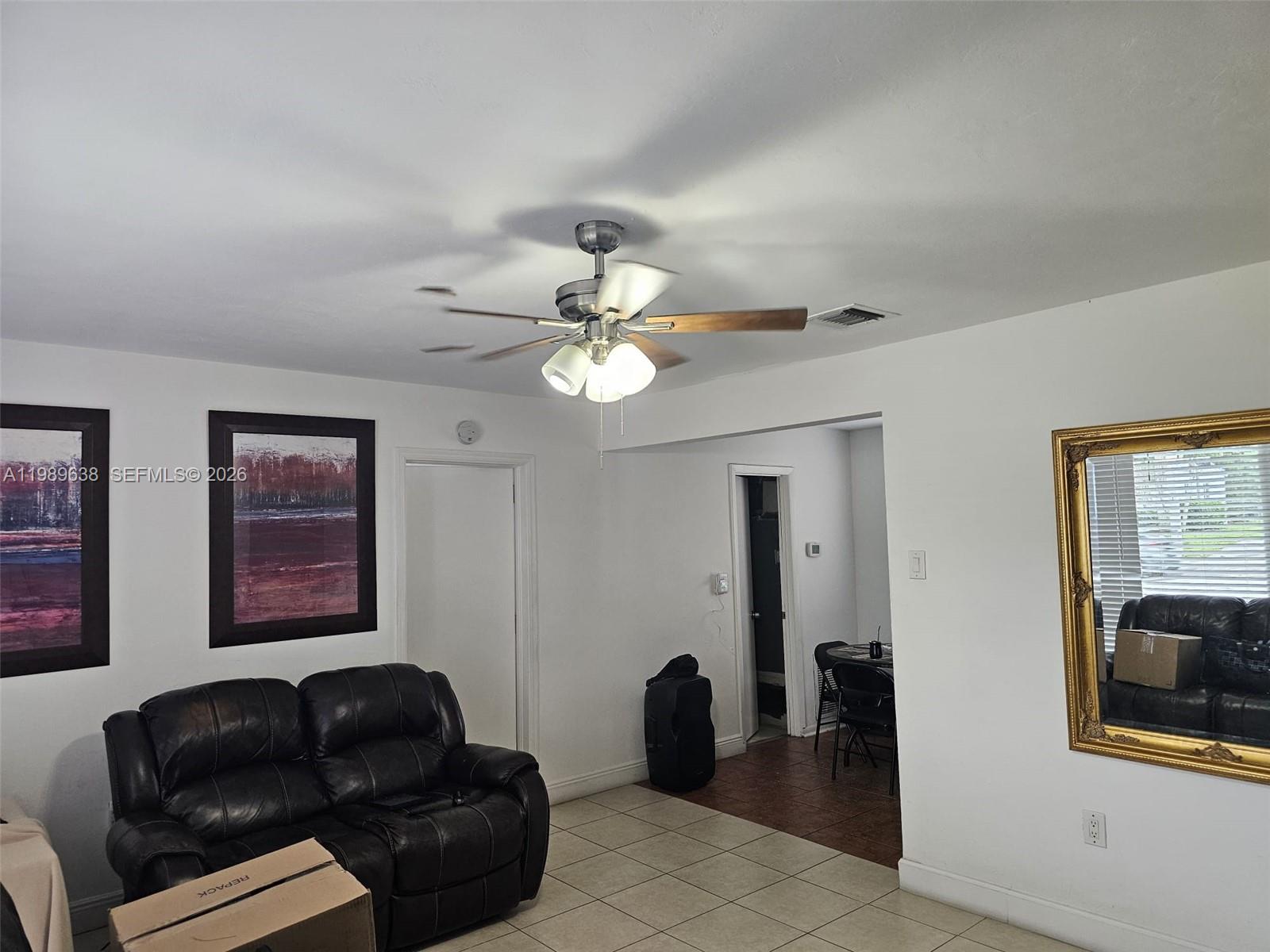 569 Tallulah Road Lake Worth, FL 33462 - Photo 25 of 40 a living room with furniture and two large window
