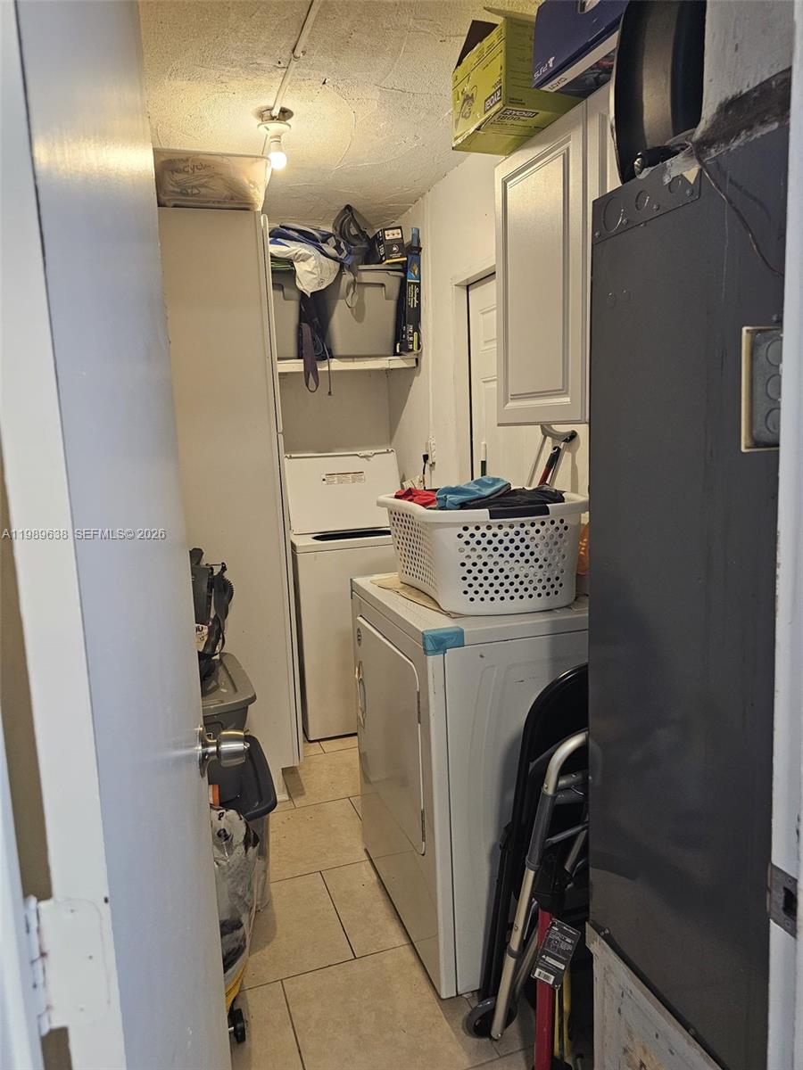 569 Tallulah Road Lake Worth, FL 33462 - Photo 27 of 40 a utility room with dryer and washer