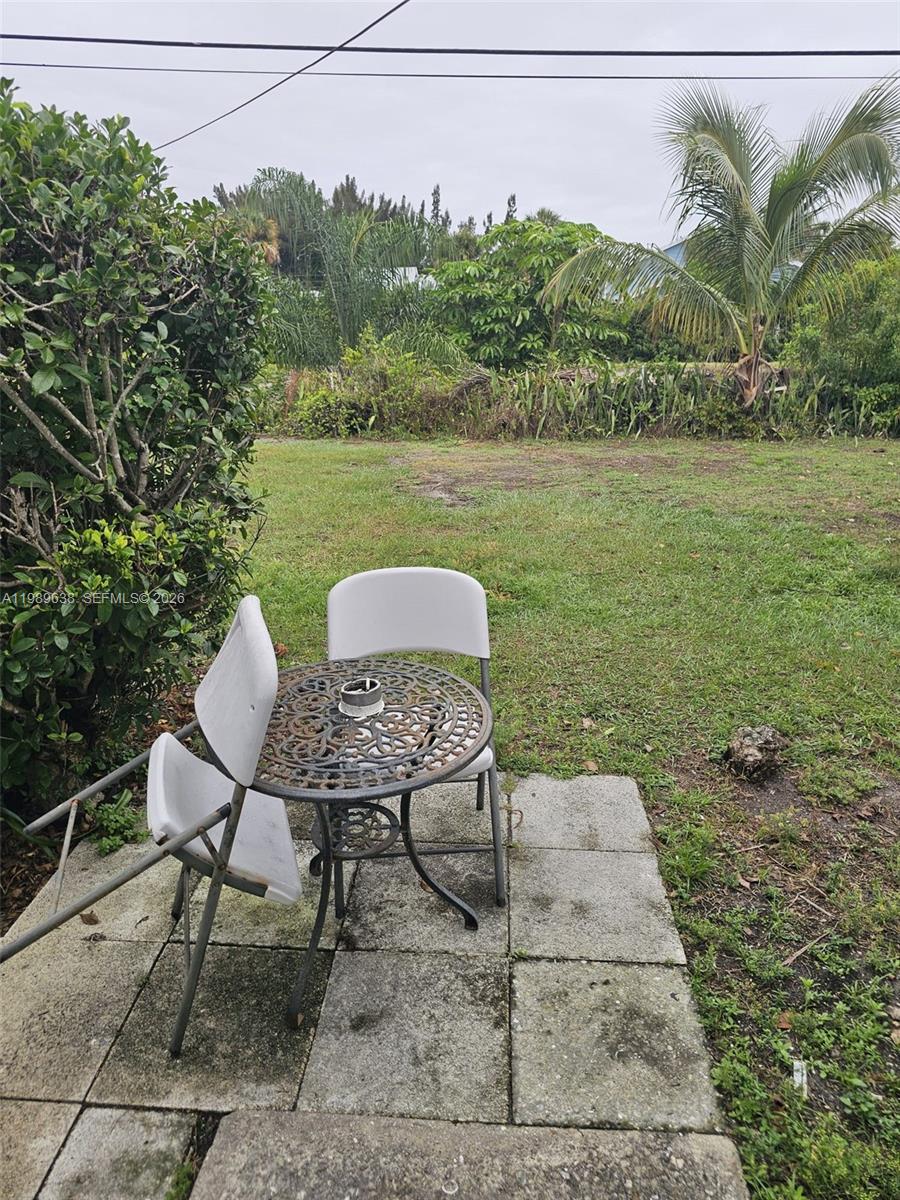 569 Tallulah Road Lake Worth, FL 33462 - Photo 28 of 40 a view of a chairs in backyard of the house