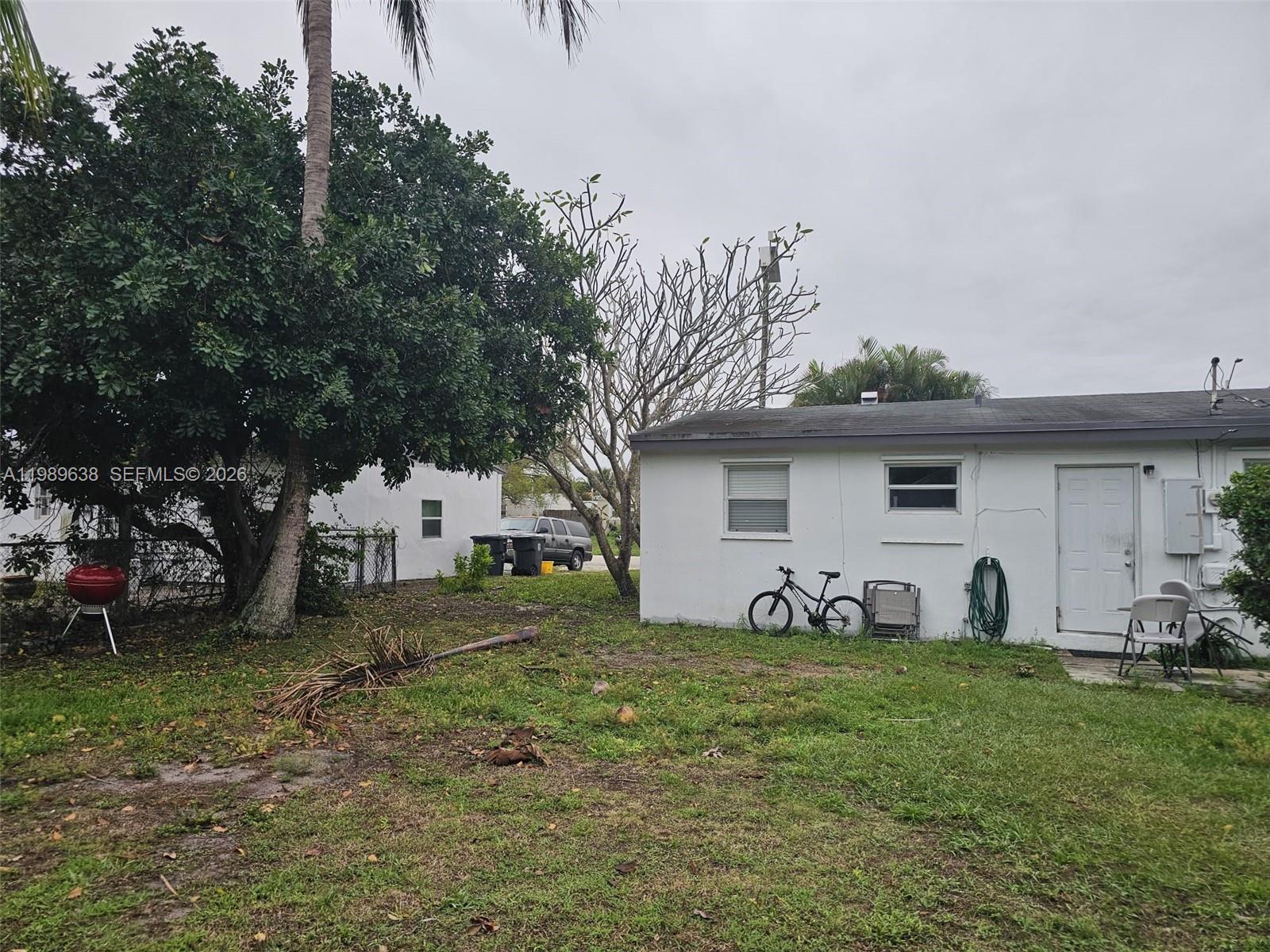 569 Tallulah Road Lake Worth, FL 33462 - Photo 30 of 40 a view of a house with a yard