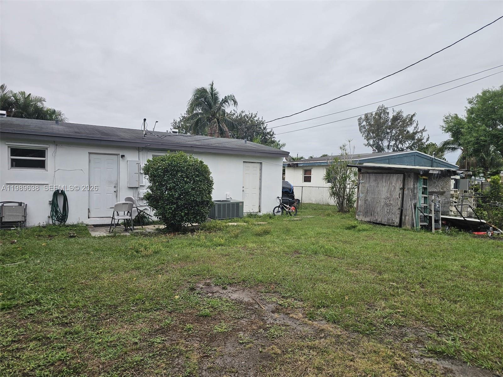 569 Tallulah Road Lake Worth, FL 33462 - Photo 3 of 40 a view of a house with backyard
