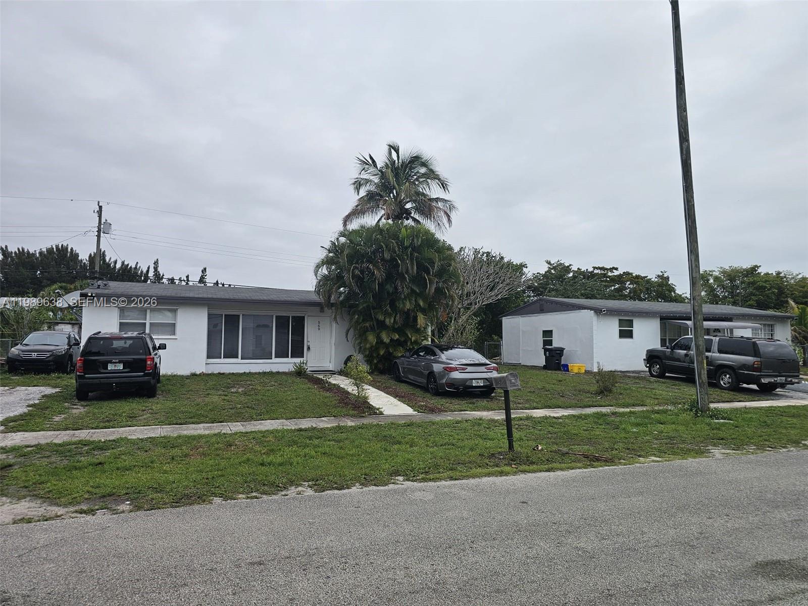 569 Tallulah Road Lake Worth, FL 33462 - Photo 36 of 40 a house view with a sitting space and garden