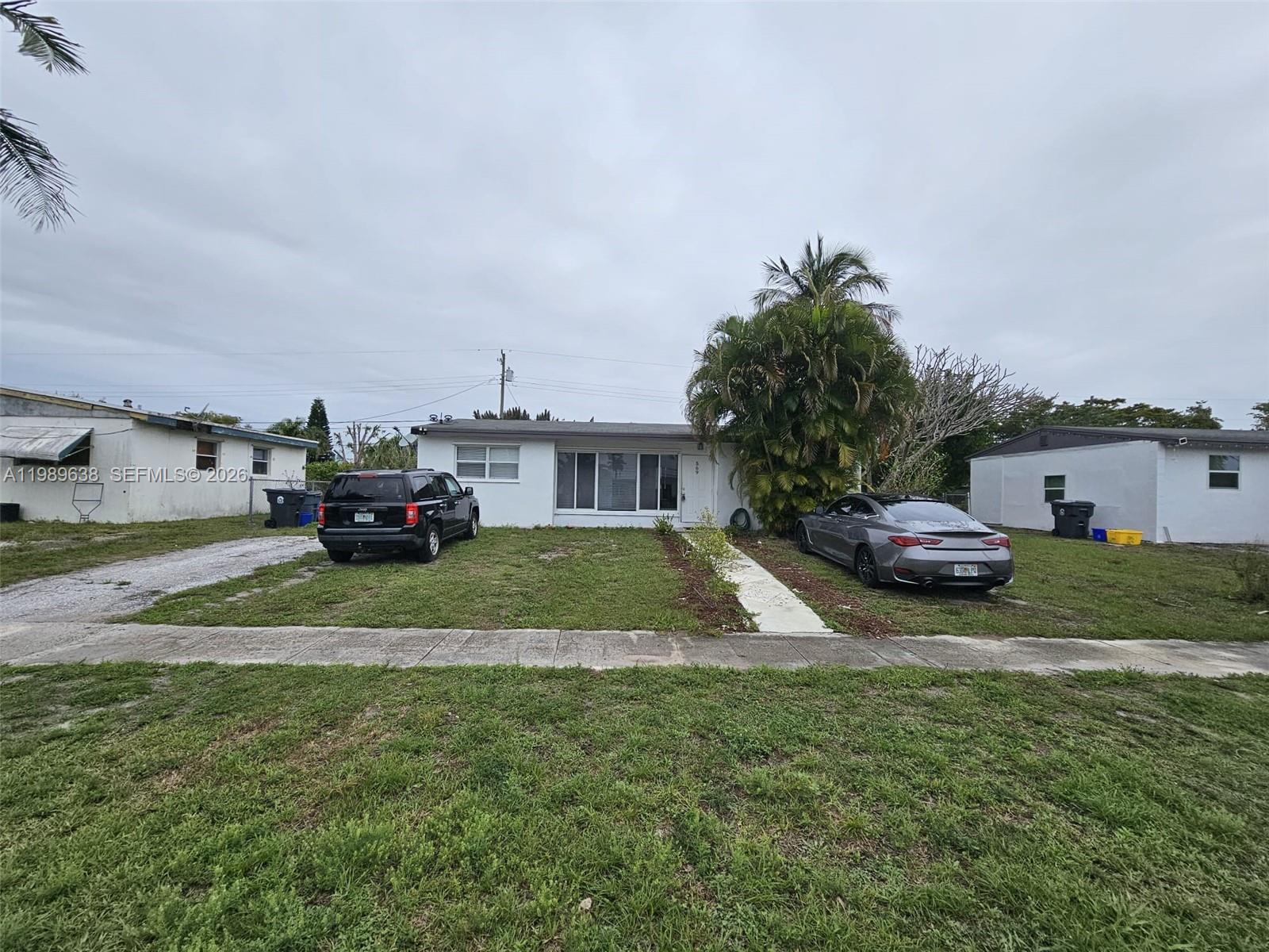 569 Tallulah Road Lake Worth, FL 33462 - Photo 37 of 40 a view of a house with a back yard