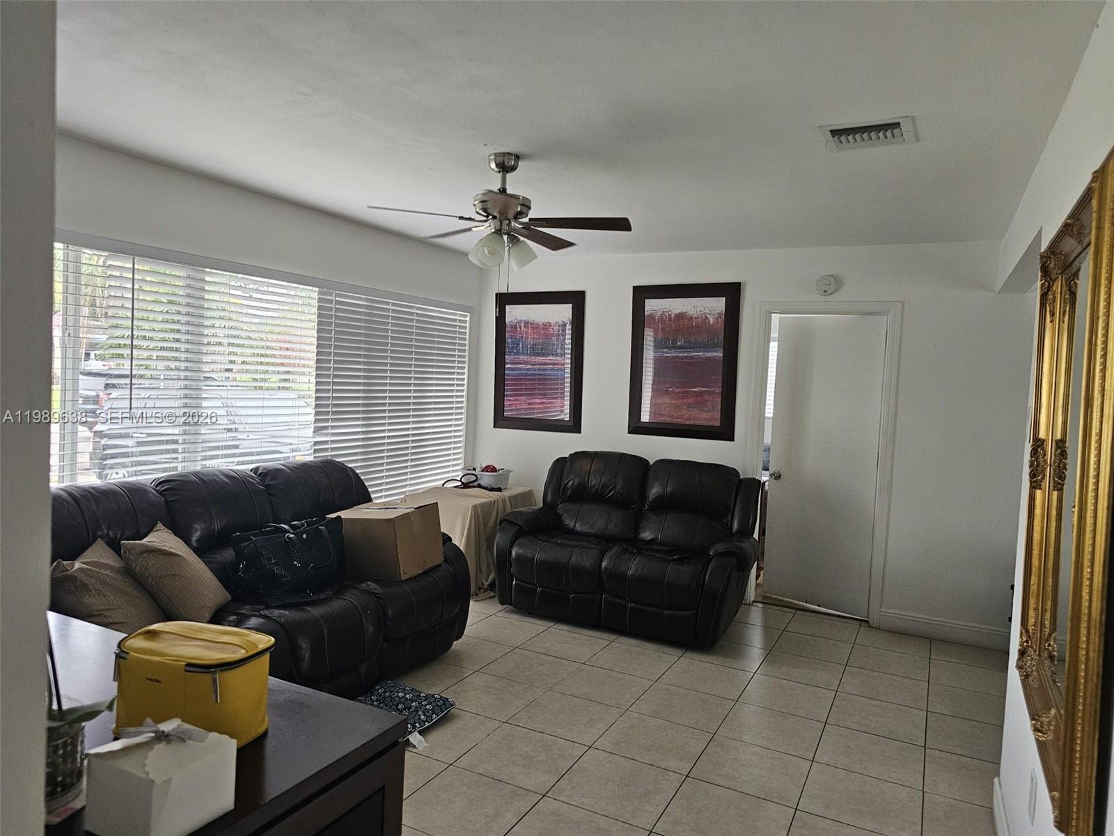 569 Tallulah Road Lake Worth, FL 33462 - Photo 6 of 40 a living room with furniture and a window