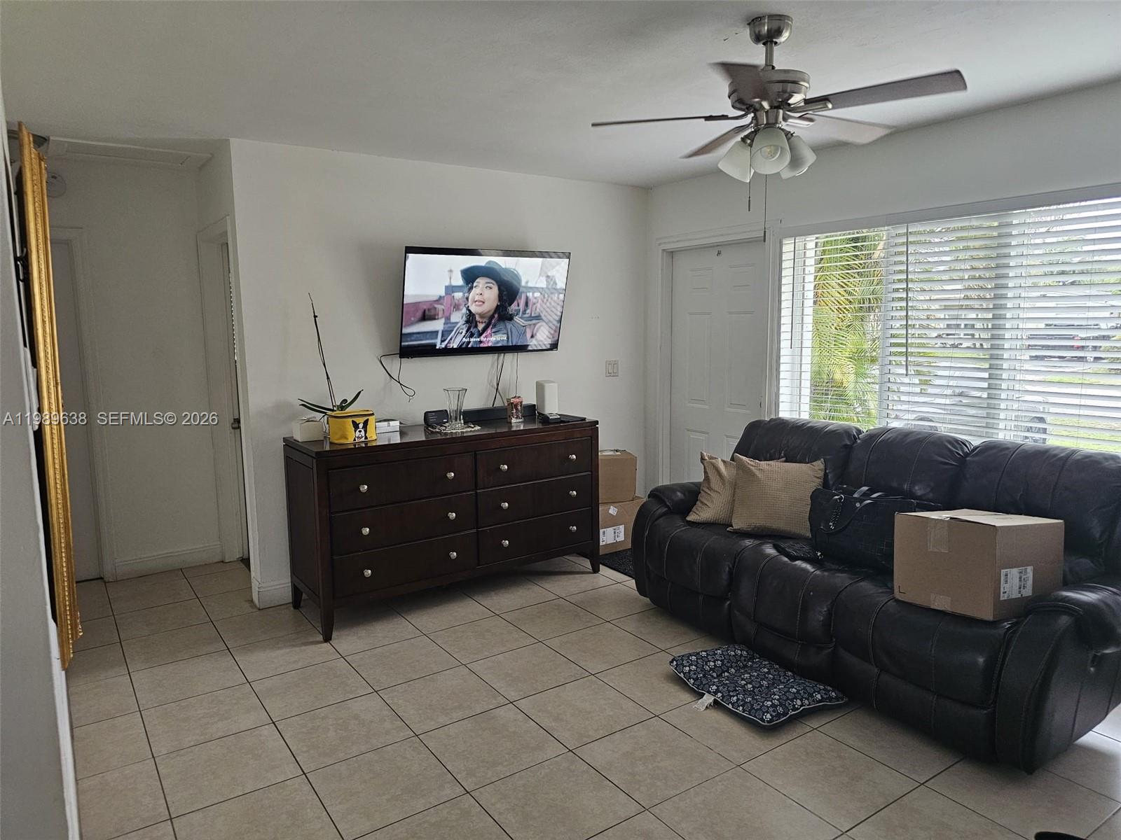 569 Tallulah Road Lake Worth, FL 33462 - Photo 7 of 40 a living room with furniture and a window