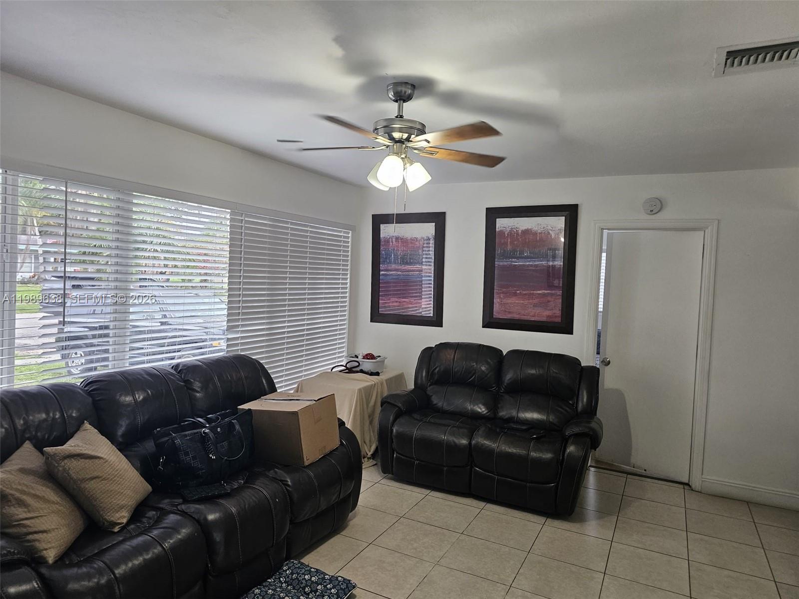 569 Tallulah Road Lake Worth, FL 33462 - Photo 8 of 40 a living room with furniture and a window