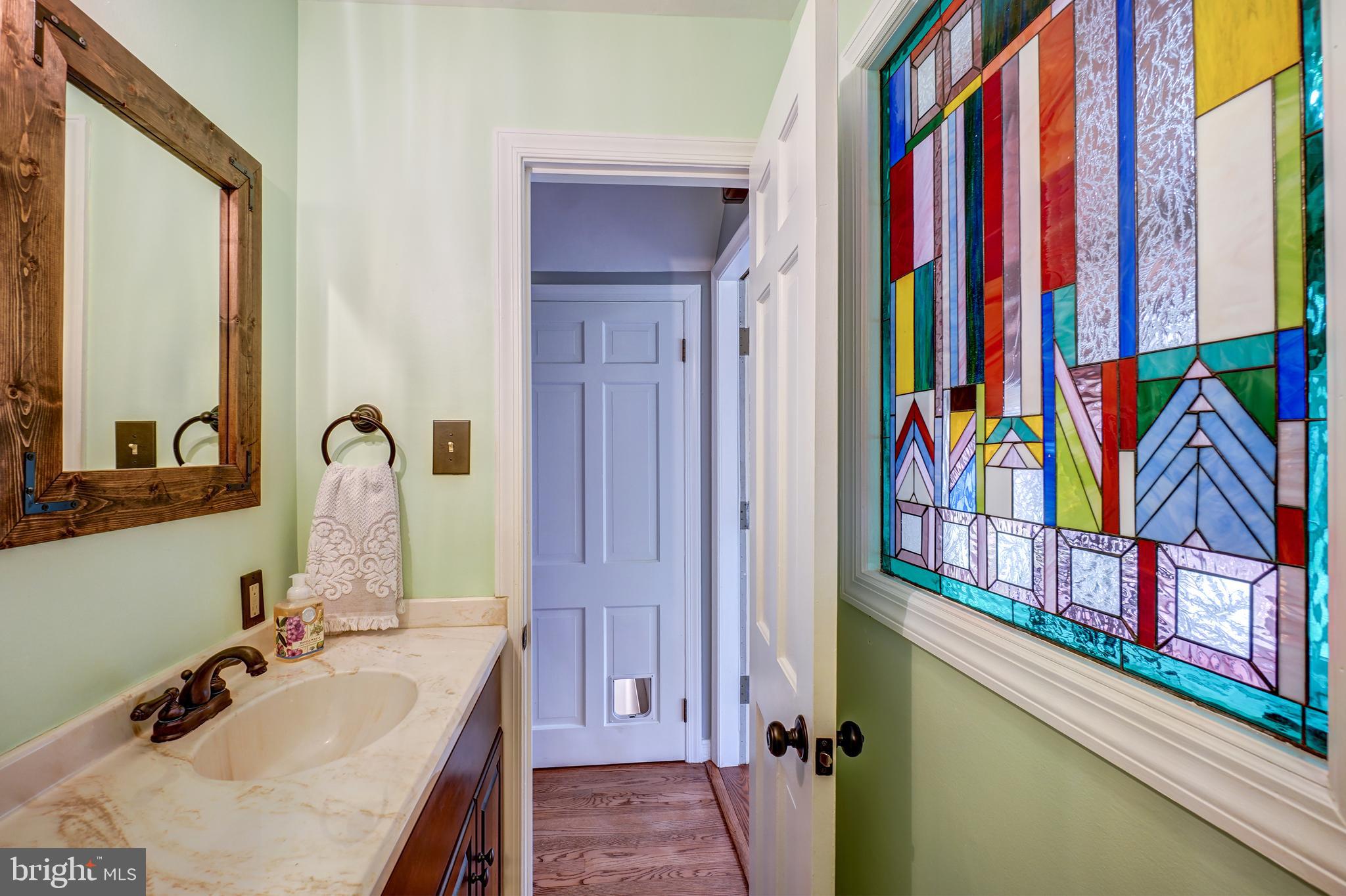 1210 Ashton Road Ashton, MD 20861 - Photo 20 of 37 First Floor Bath w/ Stained Glass Window