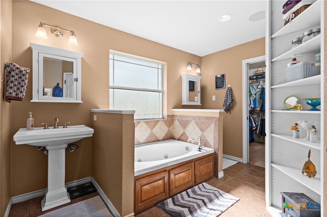 690 A County Road 4707 Kempner, TX 76539 - Photo 15 of 39 a bathroom with a sink and a mirror