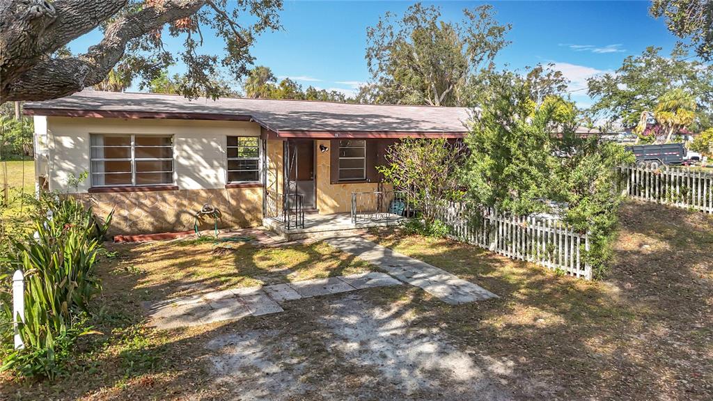 5512 Daniels Road Tampa, FL 33634 - Photo 1 of 1 a view of a house with yard and sitting area