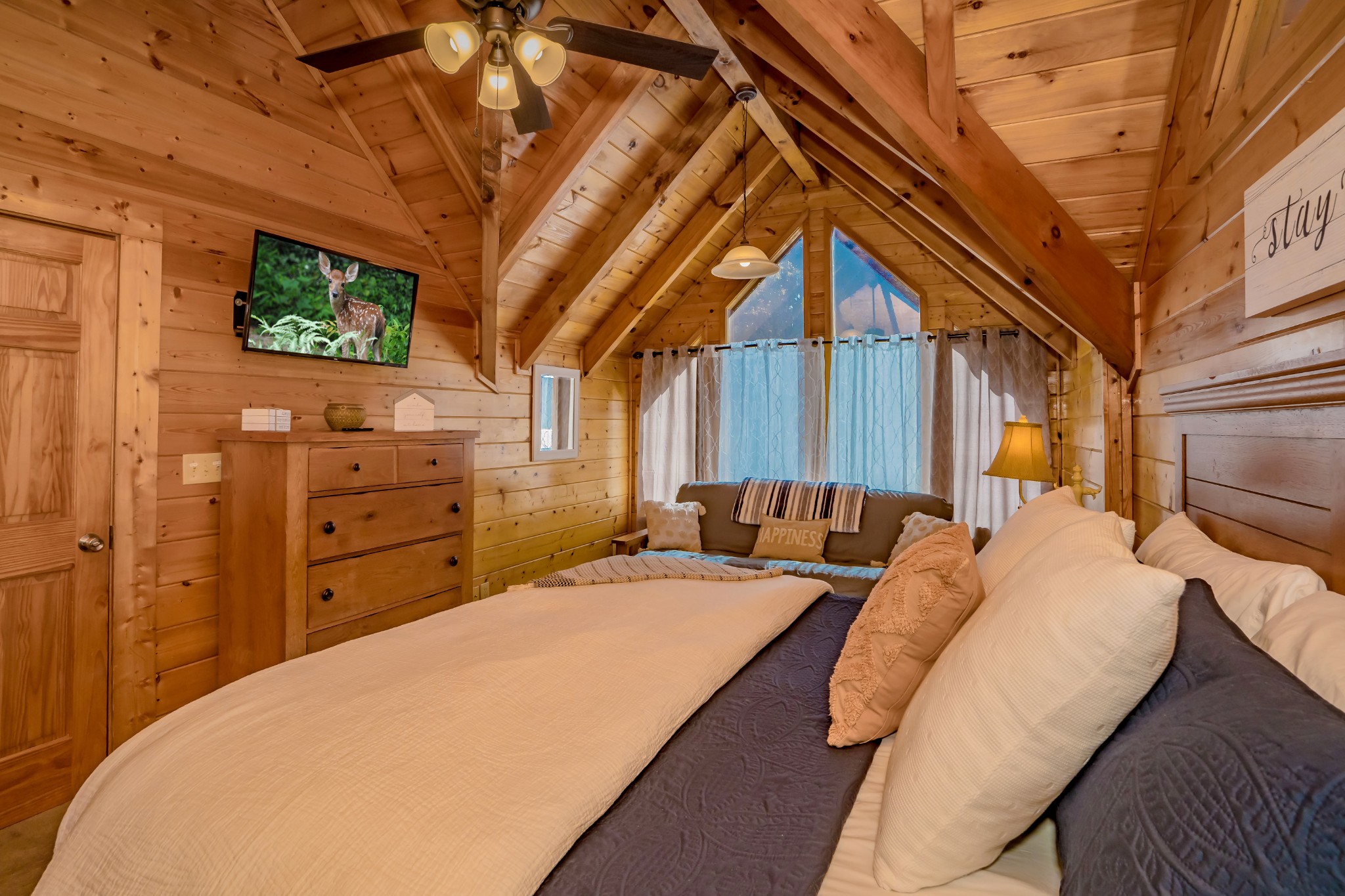 552 Blackberry Rdg Way Sevierville, TN 37863 - Photo 16 of 22 a bed sitting in a bedroom next to a window