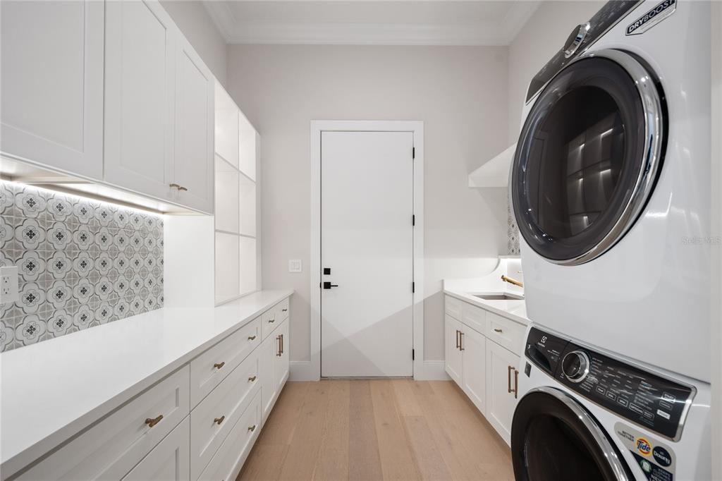 1751 Glencoe Road Winter Park, FL 32789 - Photo 22 of 45 a view of a storage and utility room with washer and dryer