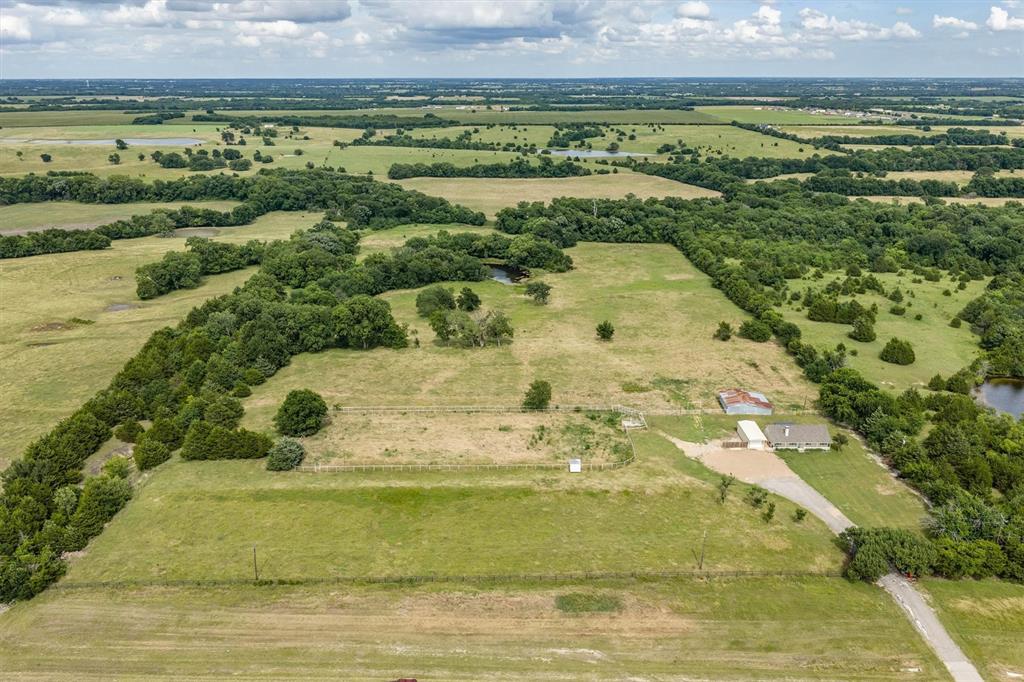 13132 Highway 78 Blue Ridge, TX 75424 - Photo 23 of 35 Expansive rural property featuring a single-story residence, multiple outbuildings, and a pond