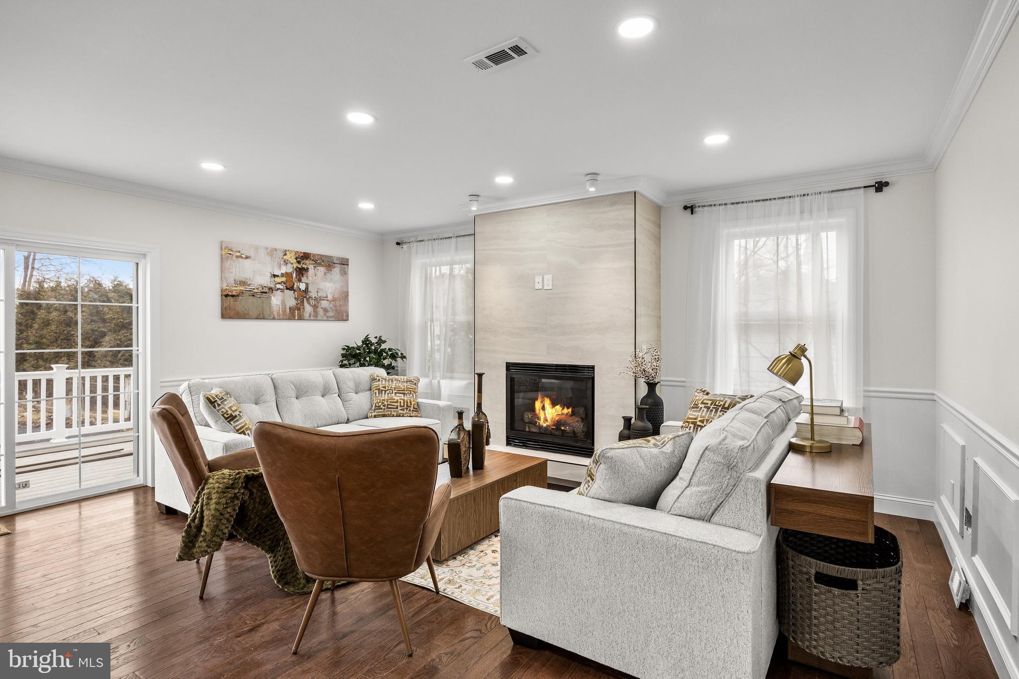 15 Cuthbert Boulevard Haddon Township, NJ 08107 - Photo 24 of 60 a living room with furniture a fireplace and a table