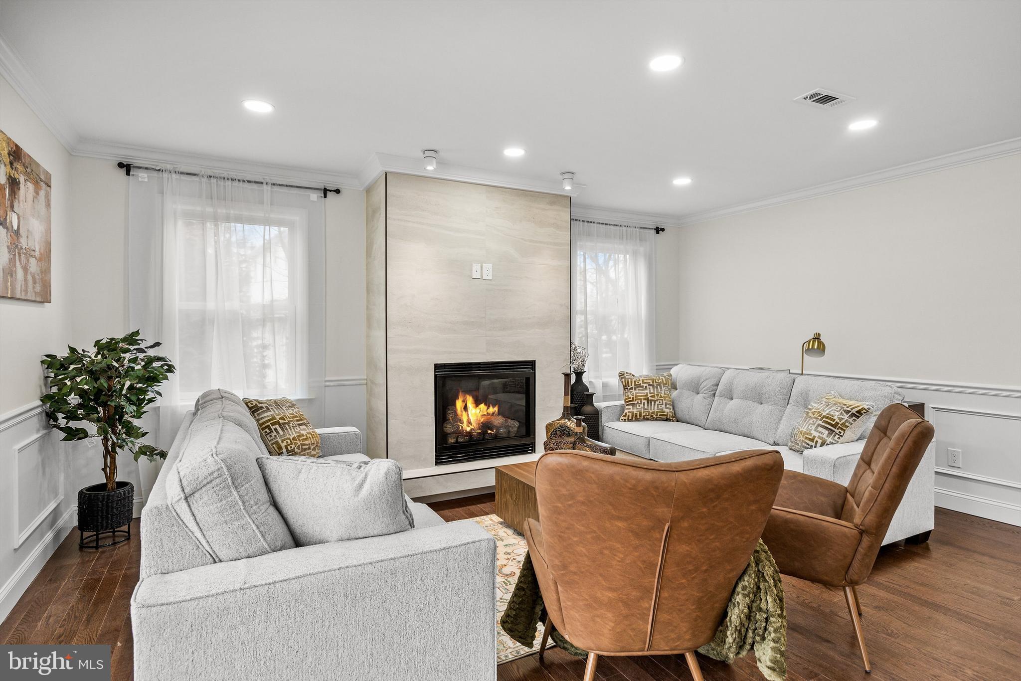 15 Cuthbert Boulevard Haddon Township, NJ 08107 - Photo 31 of 60 a living room with furniture and a fireplace