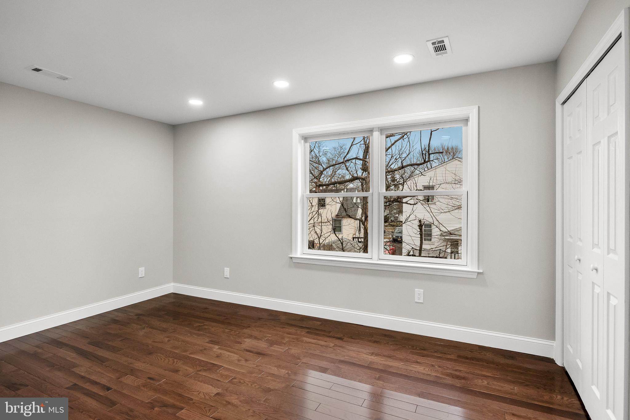 15 Cuthbert Boulevard Haddon Township, NJ 08107 - Photo 44 of 60 an empty room with wooden floor and windows