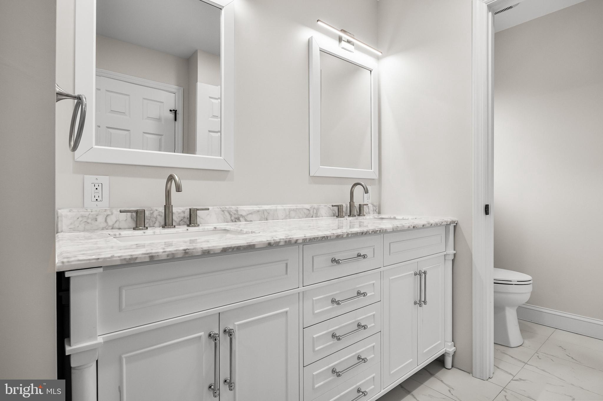 15 Cuthbert Boulevard Haddon Township, NJ 08107 - Photo 46 of 60 a bathroom with a granite countertop sink mirror and toilet