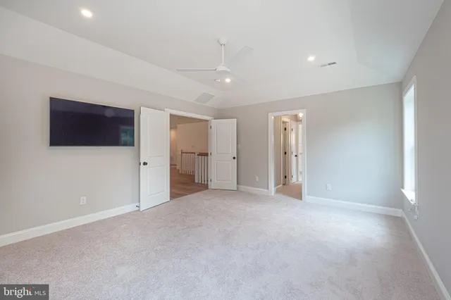 a bathroom with a double vanity sink mirror and shower