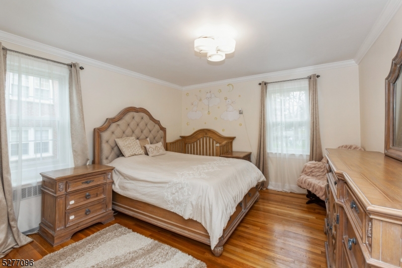 390 Morris Avenue, Unit 29 Summit, NJ 07901 - Photo 11 of 18 a bedroom with a bed and window