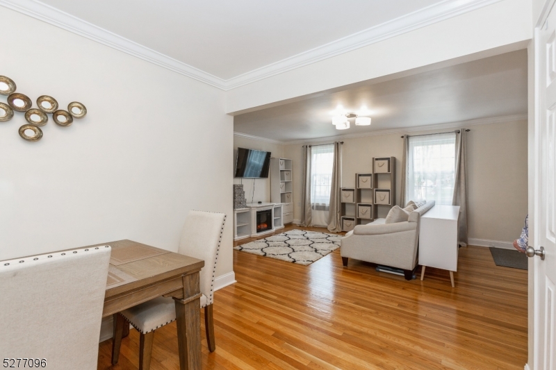 390 Morris Avenue, Unit 29 Summit, NJ 07901 - Photo 16 of 18 a living room with furniture and a wooden floor