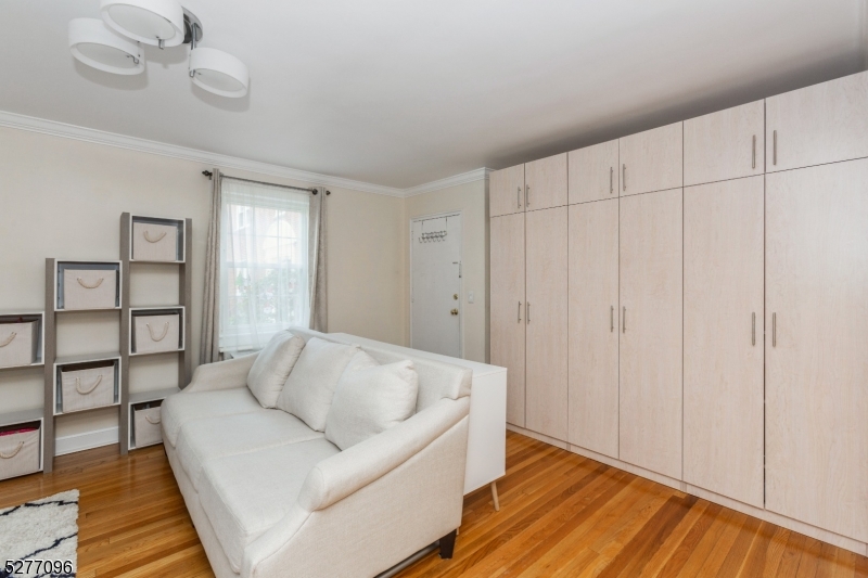 390 Morris Avenue, Unit 29 Summit, NJ 07901 - Photo 6 of 18 a living room with furniture and wooden floor
