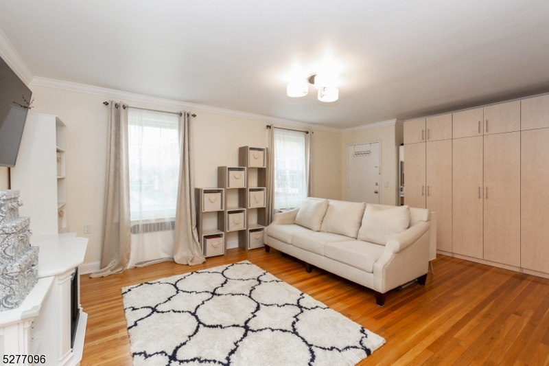 390 Morris Avenue, Unit 29 Summit, NJ 07901 - Photo 7 of 18 a living room with furniture and a table