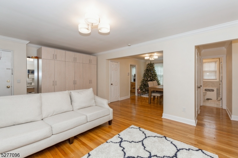390 Morris Avenue, Unit 29 Summit, NJ 07901 - Photo 10 of 18 a living room with furniture and wooden floor