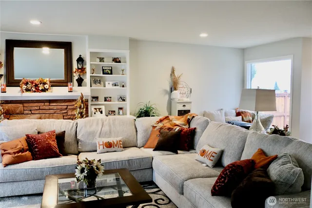 a kitchen with a sink stove and chairs