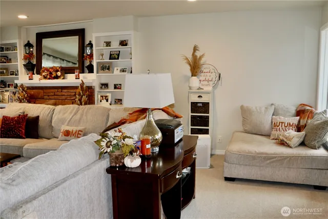 a kitchen with a table chairs and a wooden floor