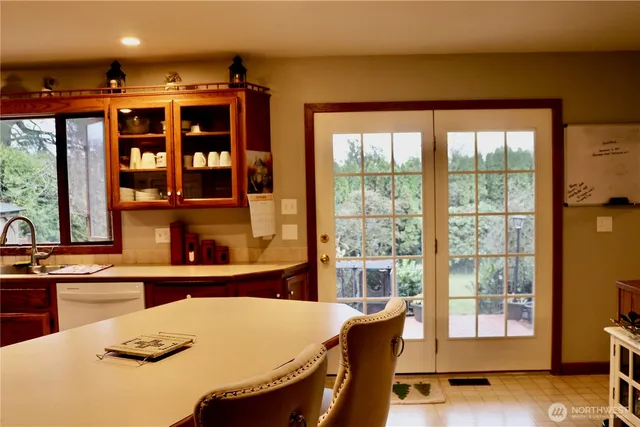 a view of a house with a backyard and deck