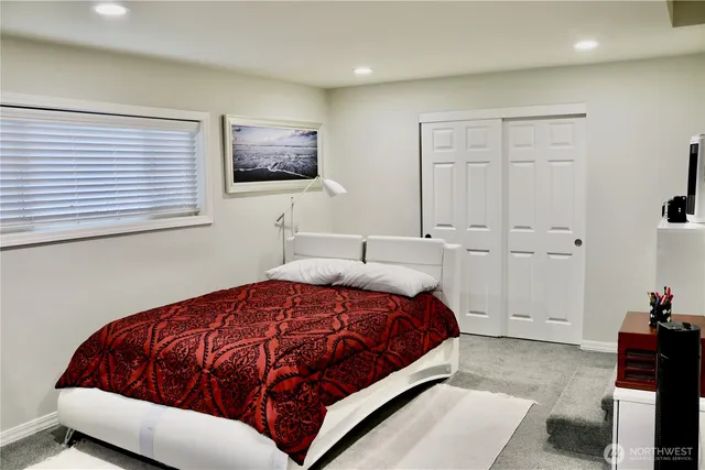 a bedroom with a bed and closet