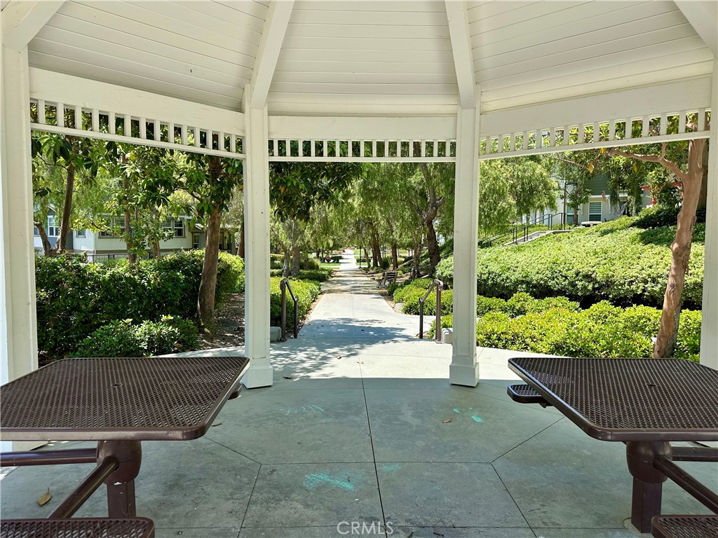 21 Durlston Way Ladera Ranch, CA 92694 - Photo 43 of 47 a view of a patio with a table chairs and a garden