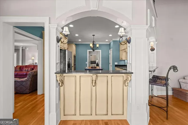 a bathroom with a stove a sink and a window