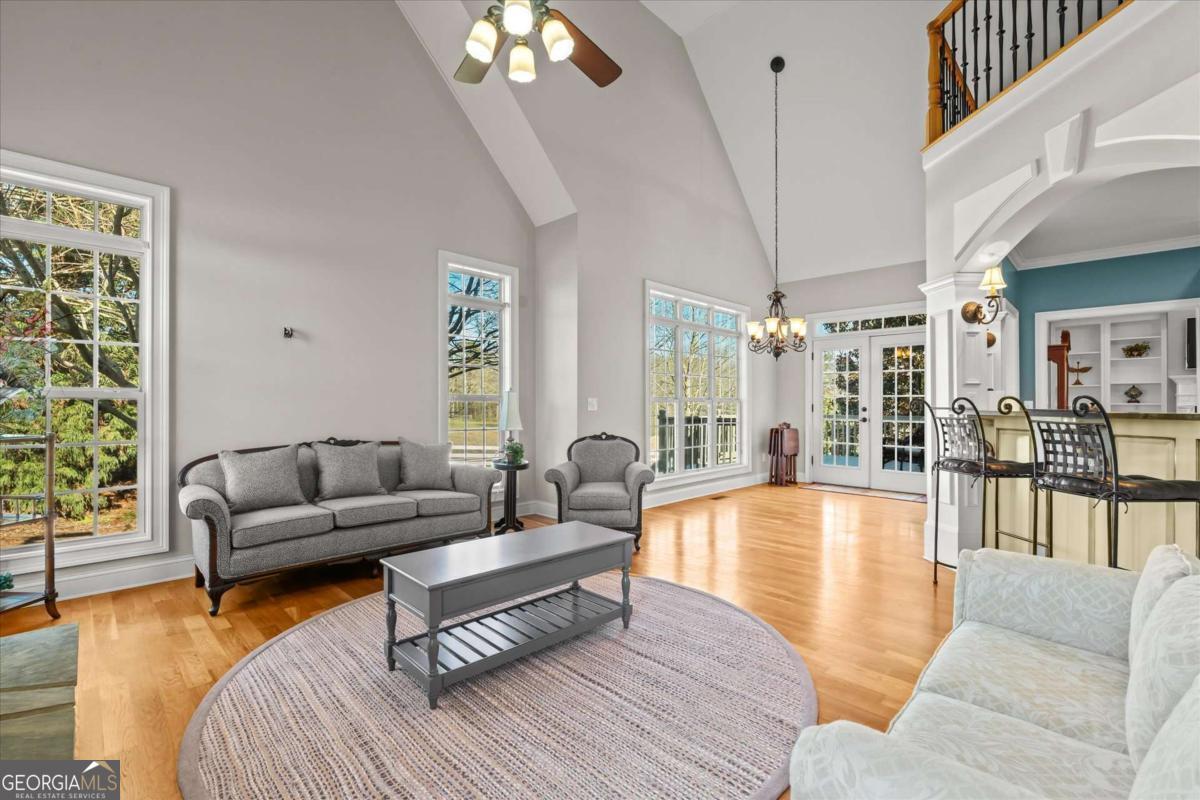 220 McKenzie Bridge Road Carrollton, GA 30117 - Photo 22 of 80 a living room with furniture and a large window