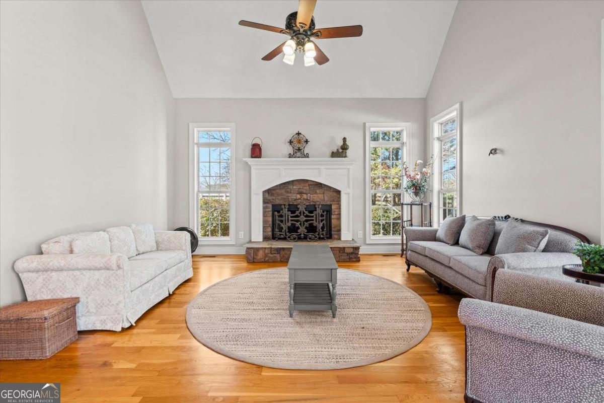 220 McKenzie Bridge Road Carrollton, GA 30117 - Photo 23 of 80 a living room with furniture and a fireplace
