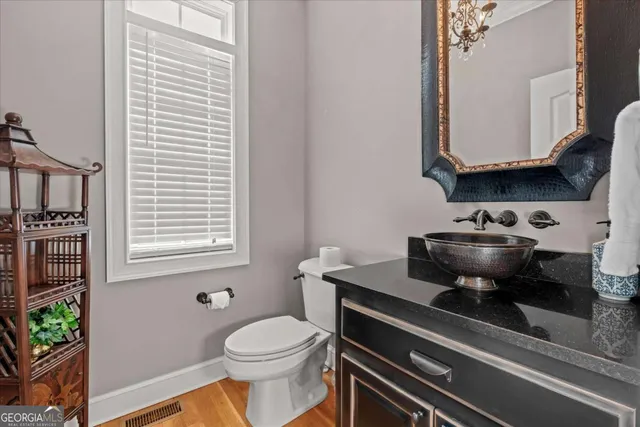 a bathroom with a shower curtain and a sink
