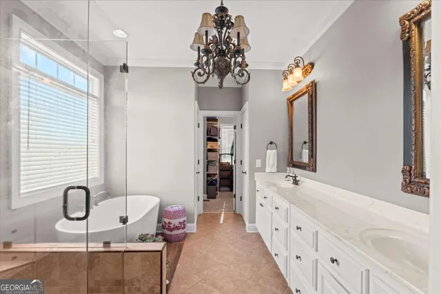 a bathroom with a sink a toilet a mirror and shower curtain