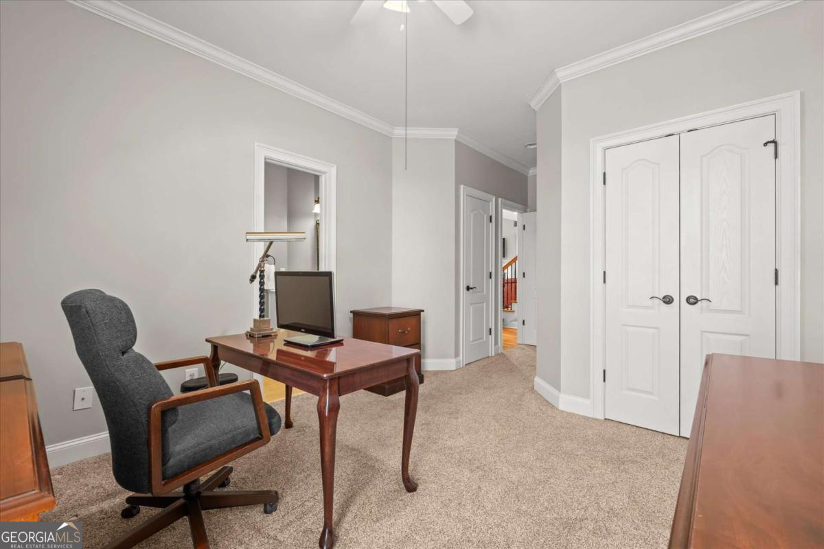 220 McKenzie Bridge Road Carrollton, GA 30117 - Photo 37 of 80 a view of a workspace with furniture and gym equipment