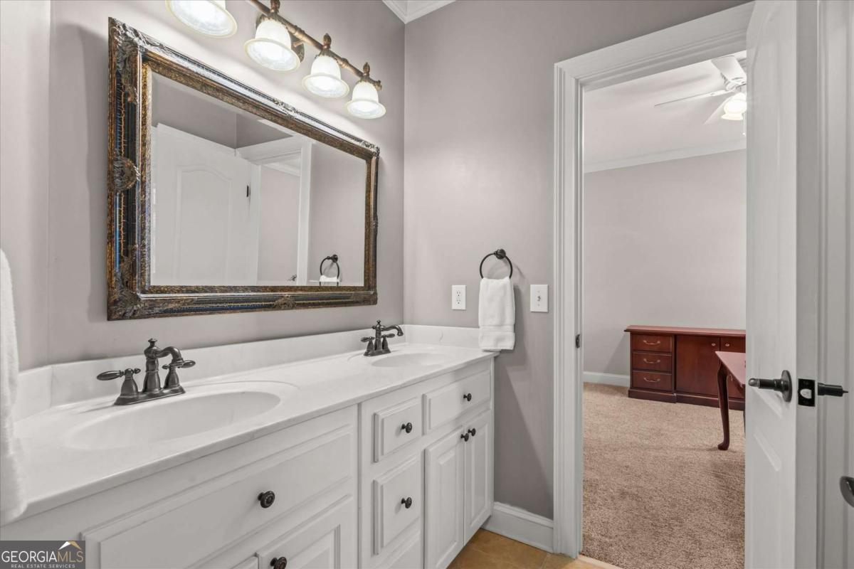 220 McKenzie Bridge Road Carrollton, GA 30117 - Photo 38 of 80 a bathroom with a double vanity sink mirror and