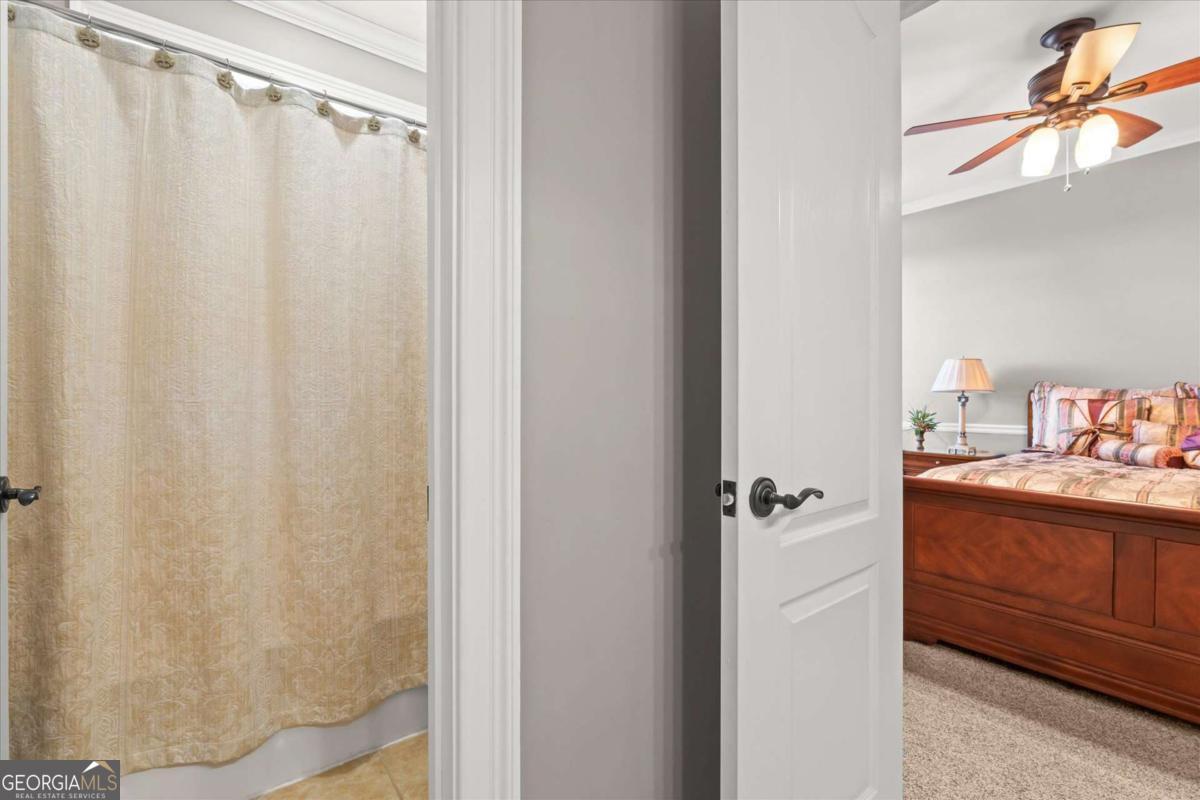 220 McKenzie Bridge Road Carrollton, GA 30117 - Photo 39 of 80 a bathroom with a shower curtain and a sink