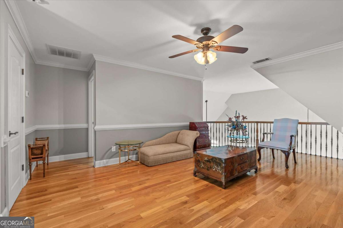 220 McKenzie Bridge Road Carrollton, GA 30117 - Photo 46 of 80 a living room with furniture and a chandelier