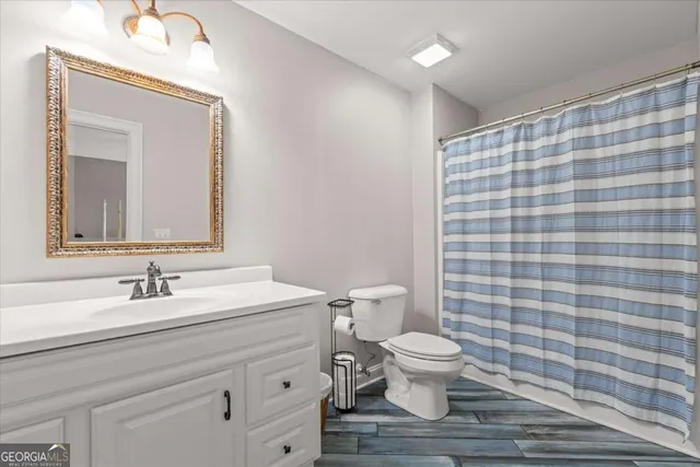 an aerial view of a houses with a lake