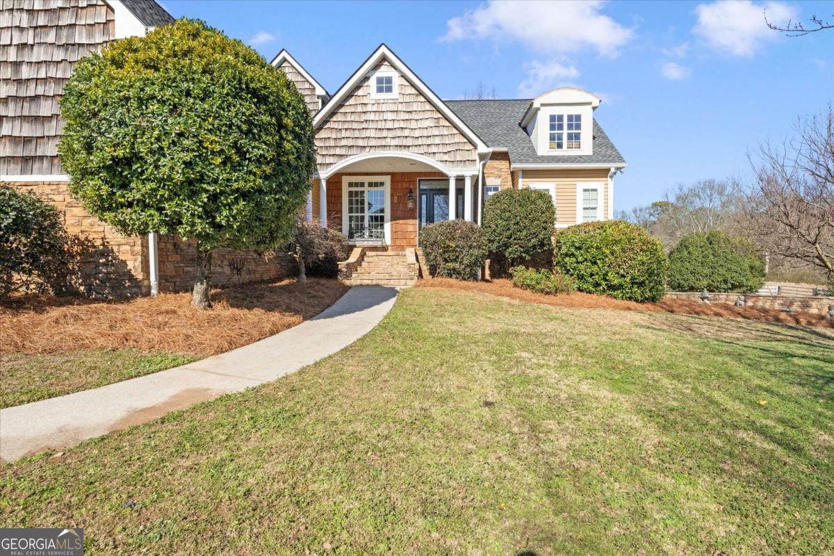 220 McKenzie Bridge Road Carrollton, GA 30117 - Photo 5 of 80 a front view of a house with a yard