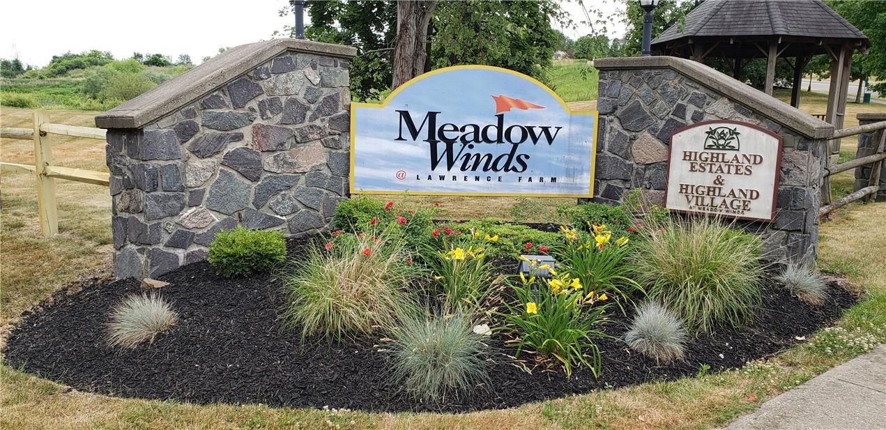 a view of outdoor space with signage and flags