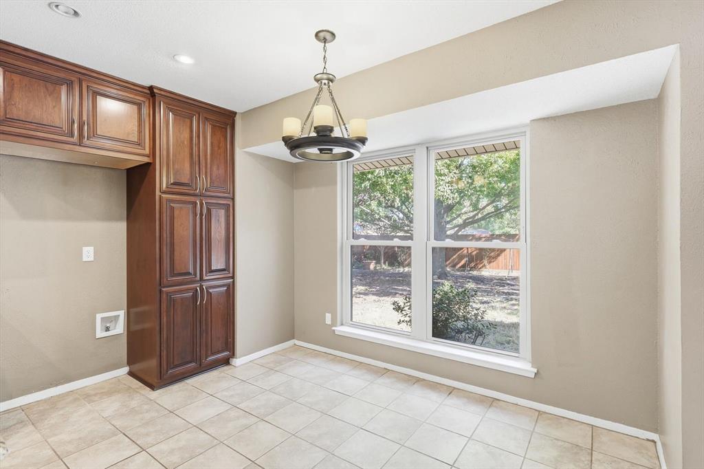 425 Ridgecrest Drive Saginaw, TX 76179 - Photo 12 of 27 a view of a livingroom with a chandelier fan and windows