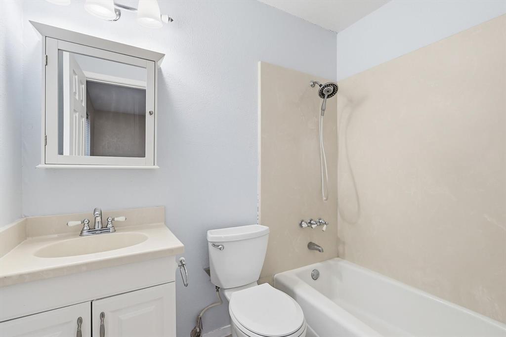 425 Ridgecrest Drive Saginaw, TX 76179 - Photo 17 of 27 a bathroom with a sink toilet and shower