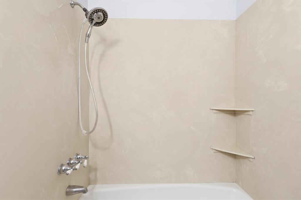 425 Ridgecrest Drive Saginaw, TX 76179 - Photo 18 of 27 a bathroom with a shower