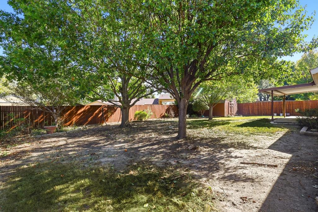 425 Ridgecrest Drive Saginaw, TX 76179 - Photo 23 of 27 a view of a yard with tree s
