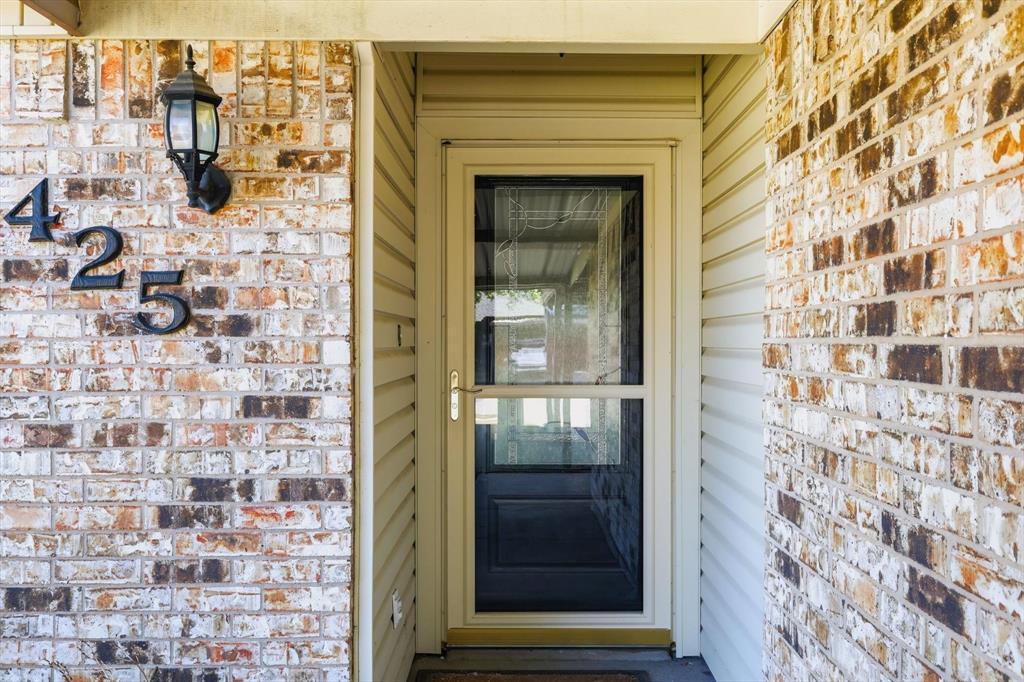 425 Ridgecrest Drive Saginaw, TX 76179 - Photo 5 of 27 a view of a door of the house